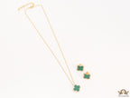 Sleek gold plated chain with cubic zirconia studded green clover shape pendant