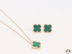 Sleek gold plated chain with cubic zirconia studded green clover shape pendant