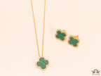 Sleek gold plated chain with cubic zirconia studded green clover shape pendant