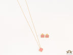 Sleek gold plated chain with cubic zirconia studded pink clover shape pendant