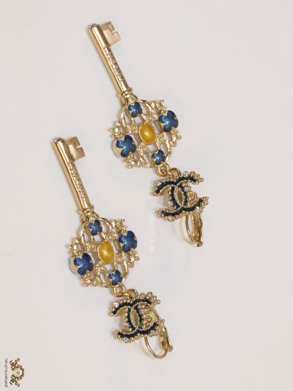 Gold plated key earrings with double C motif and clovers