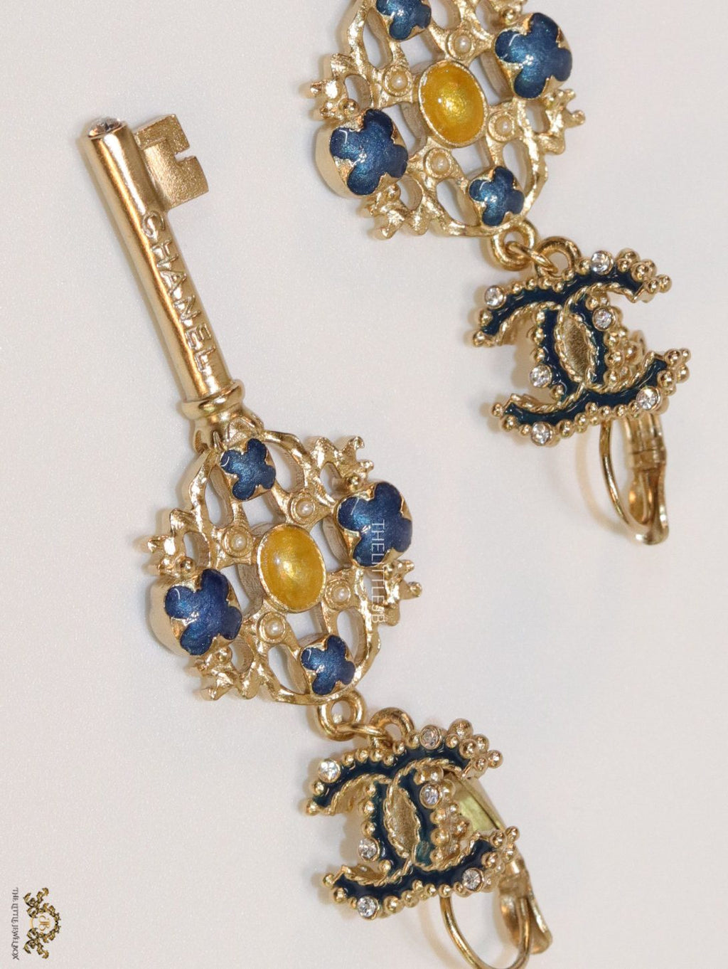 Gold plated key earrings with double C motif and clovers