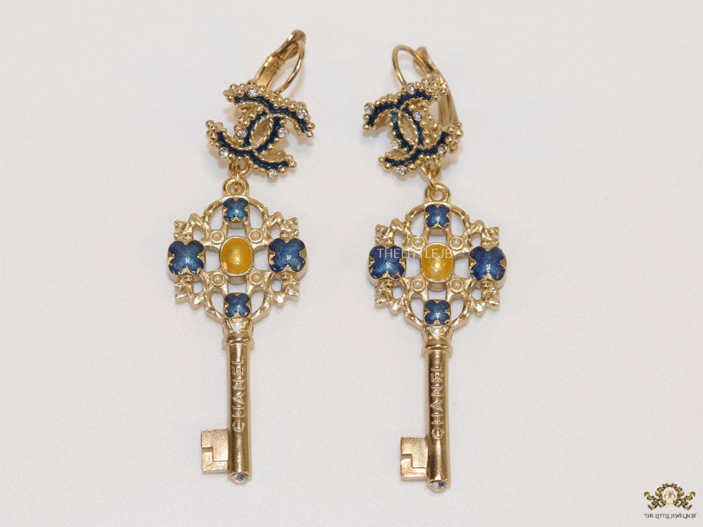 Gold plated key earrings with double C motif and clovers