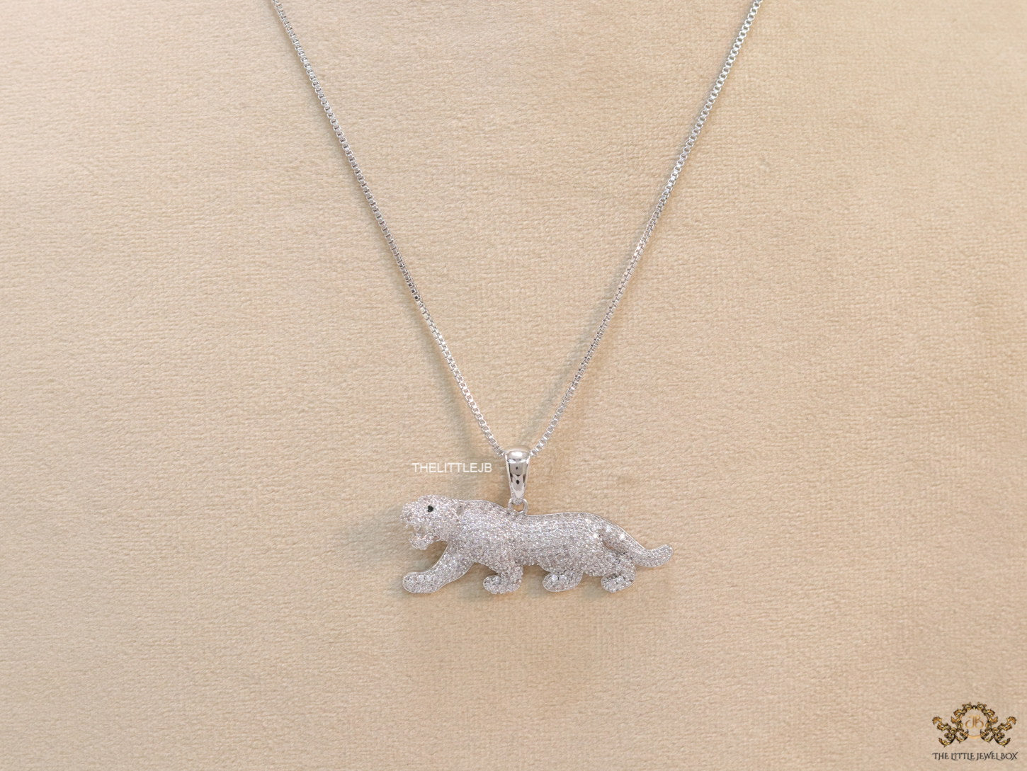 Platinum plated cubic zirconia panther pendant on sleek Platinum plated chain