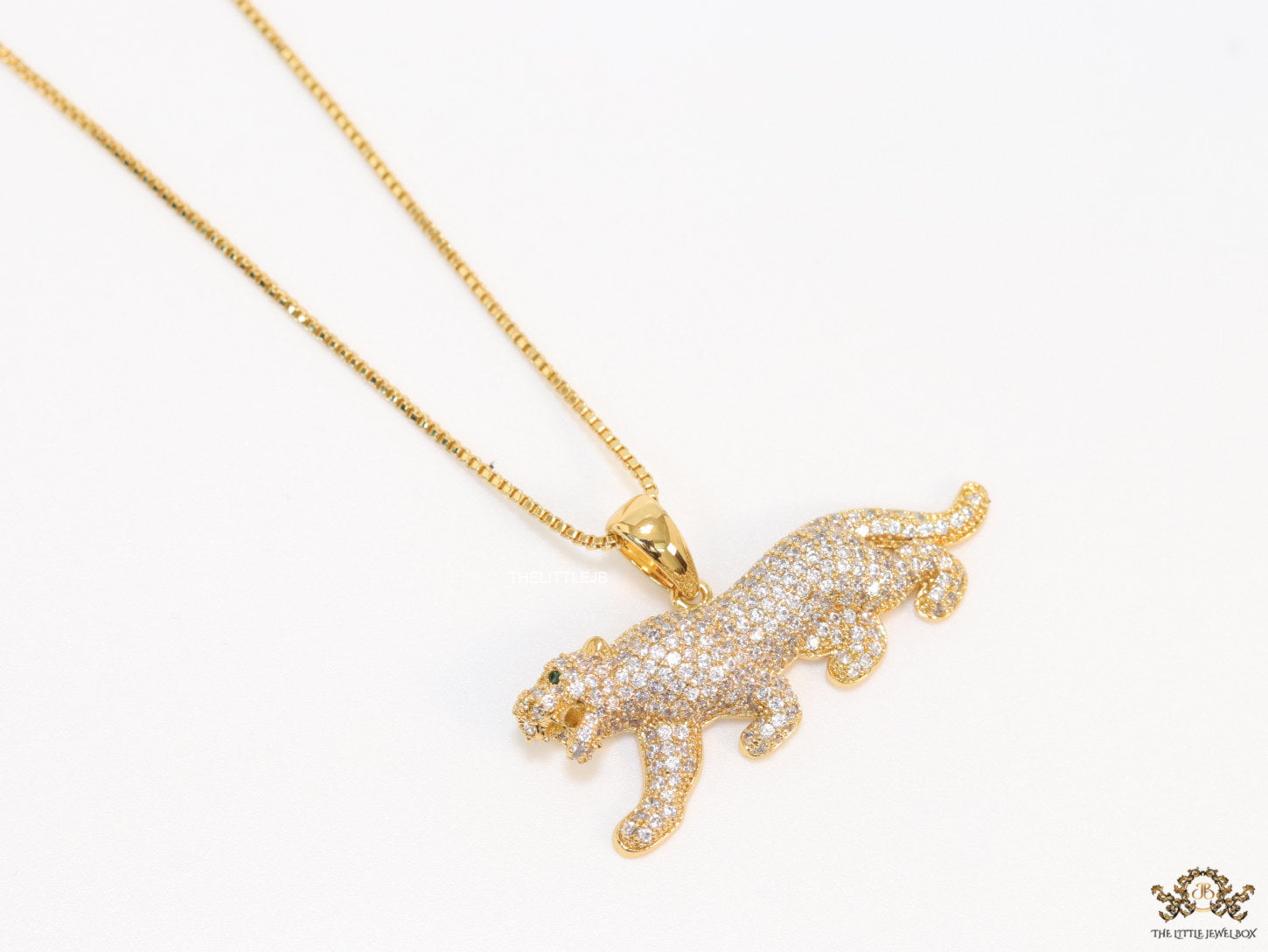 Gold plated cubic zirconia panther pendant on sleek gold plated chain