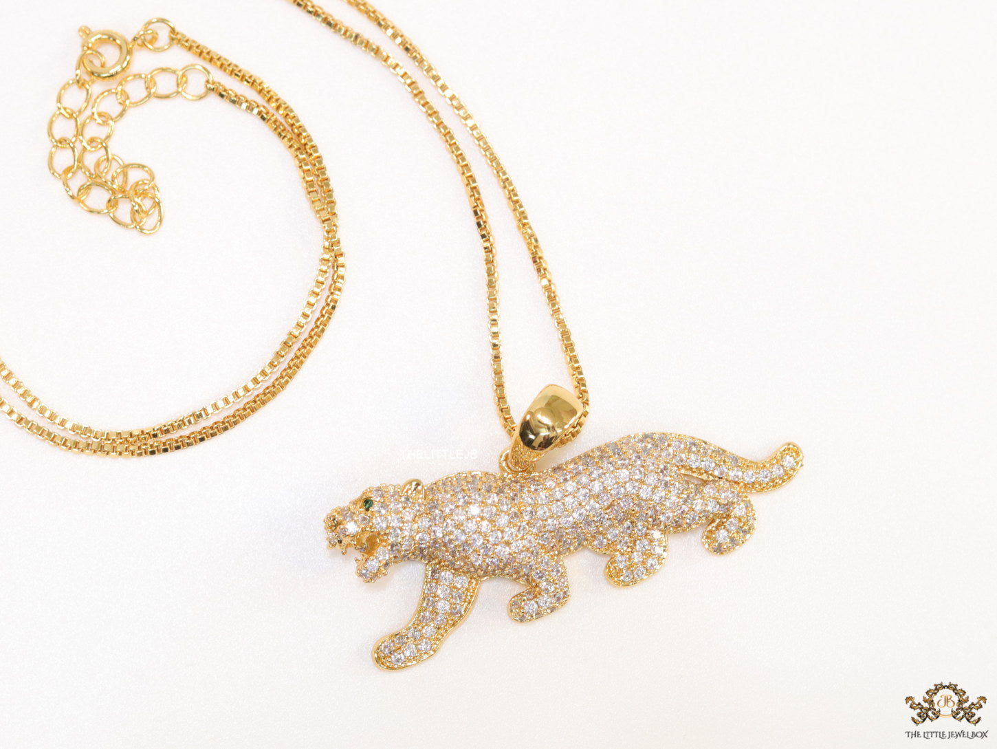 Gold plated cubic zirconia panther pendant on sleek gold plated chain