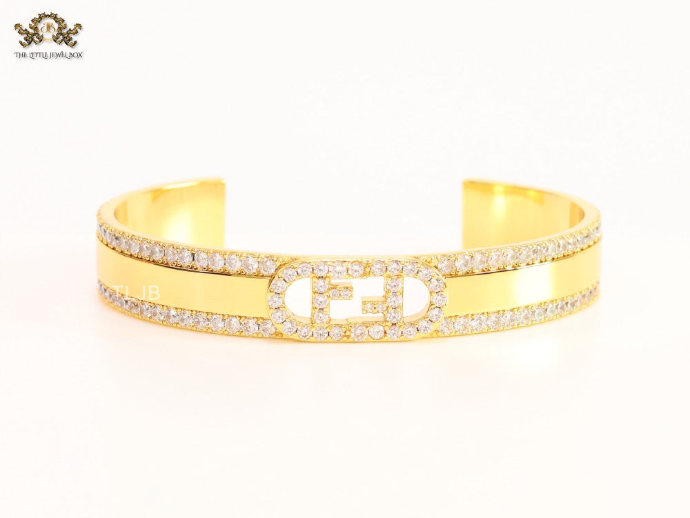 Double F on gold bracelet with cz