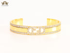 Double F on gold bracelet with cz