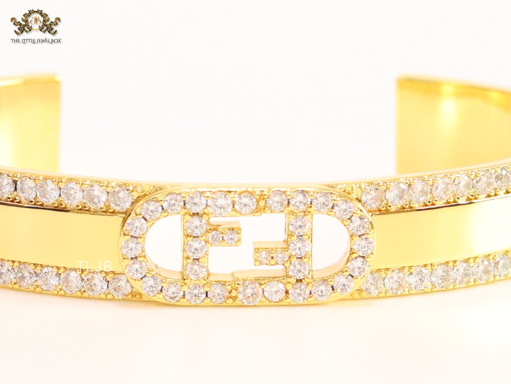 Double F on gold bracelet with cz