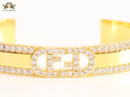 Double F on gold bracelet with cz
