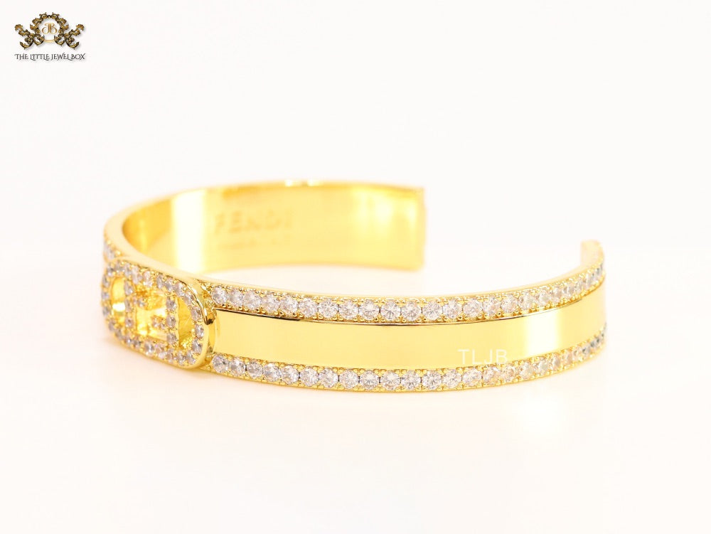Double F on gold bracelet with cz