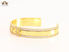 Double F on gold bracelet with cz