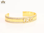 Double F on gold bracelet with cz