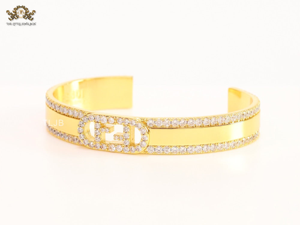 Double F on gold bracelet with cz