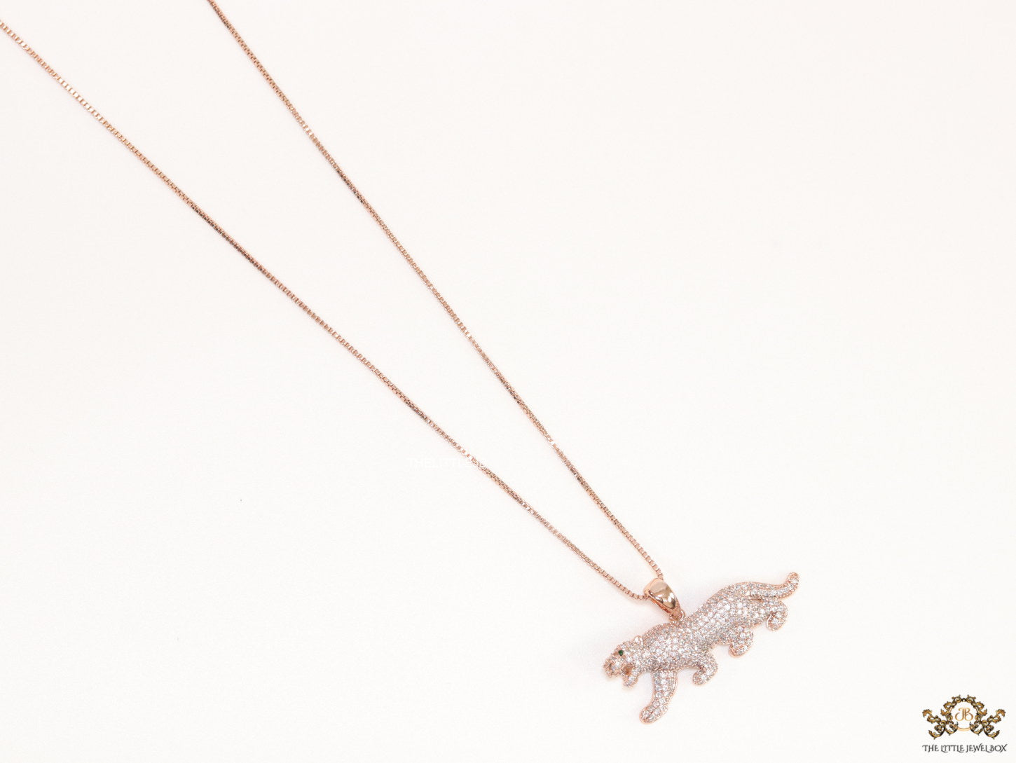 Rose Gold plated cubic zirconia panther pendant on sleek platinum plated chain