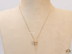 Gold plated cubic zirconia stones panther face motif pendant with emerald green stones details on sleek gold plated chain