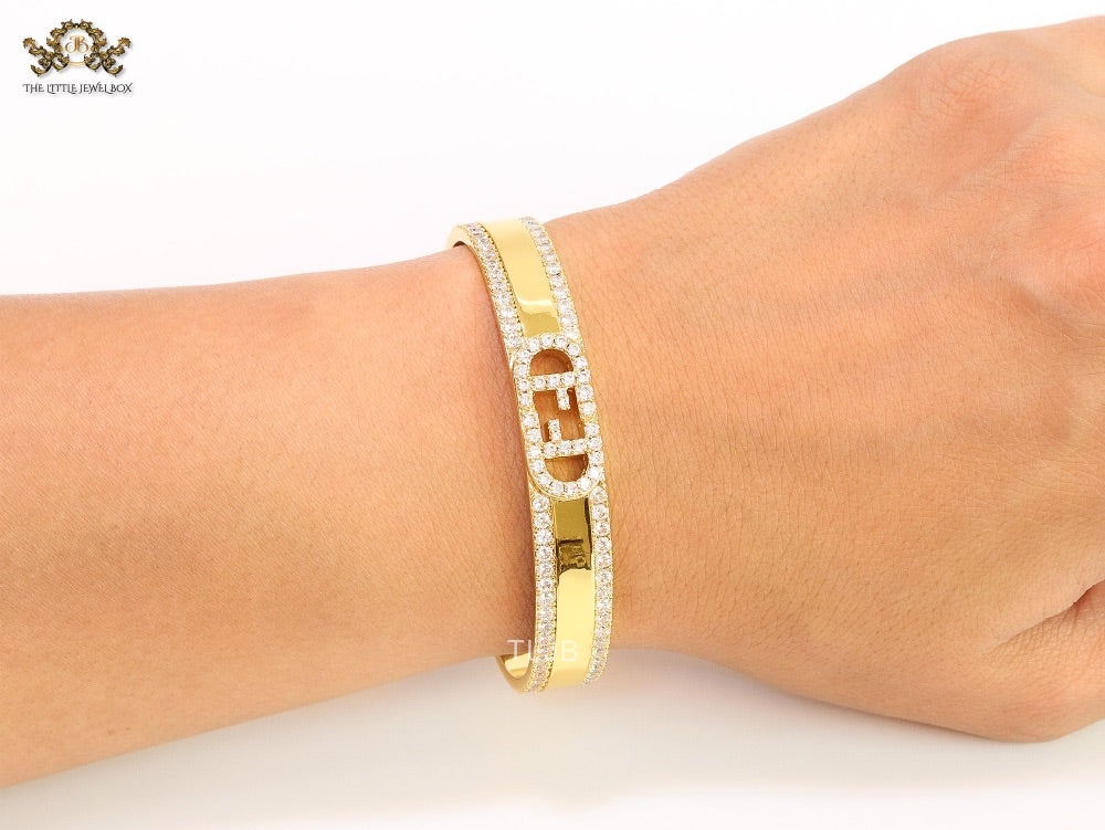 Double F on gold bracelet with cz