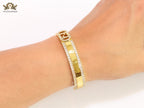 Double F on gold bracelet with cz