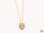Gold plated cubic zirconia stones panther face motif pendant with emerald green stones details on sleek gold plated chain
