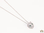 Platinum plated cubic zirconia stones panther face motif pendant with emerald green stones details on sleek Platinum plated chain