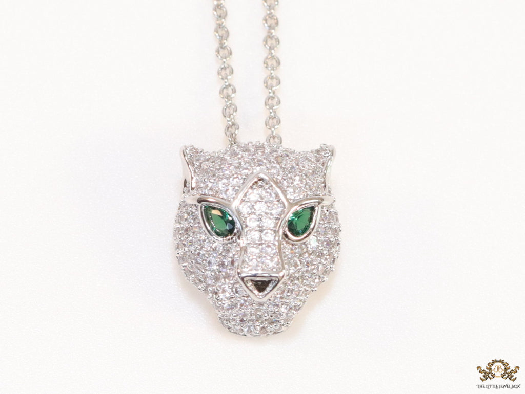 Platinum plated cubic zirconia stones panther face motif pendant with emerald green stones details on sleek Platinum plated chain