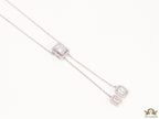 Emerald cut cubic zirconia stones in different sized on sleek platinum plated chain