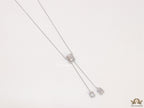 Emerald cut cubic zirconia stones in different sized on sleek platinum plated chain
