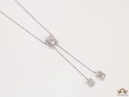 Emerald cut cubic zirconia stones in different sized on sleek platinum plated chain