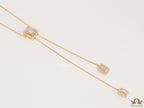 Emerald cut cubic zirconia stones in different sized on sleek gold plated chain
