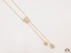 Emerald cut cubic zirconia stones in different sized on sleek gold plated chain