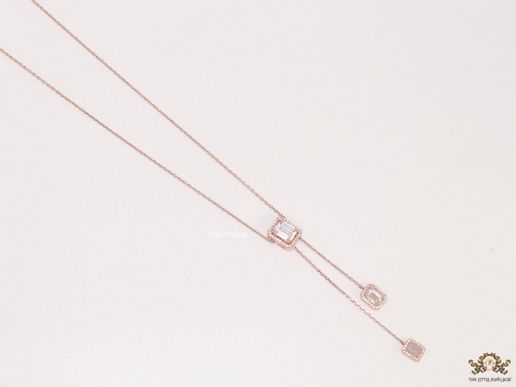 Emerald cut cubic zirconia stones in different sized on sleek rose gold plated chain