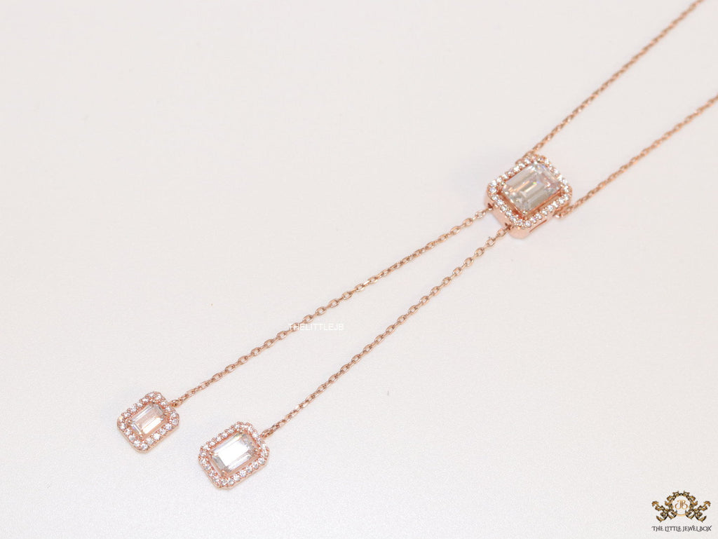 Emerald cut cubic zirconia stones in different sized on sleek rose gold plated chain