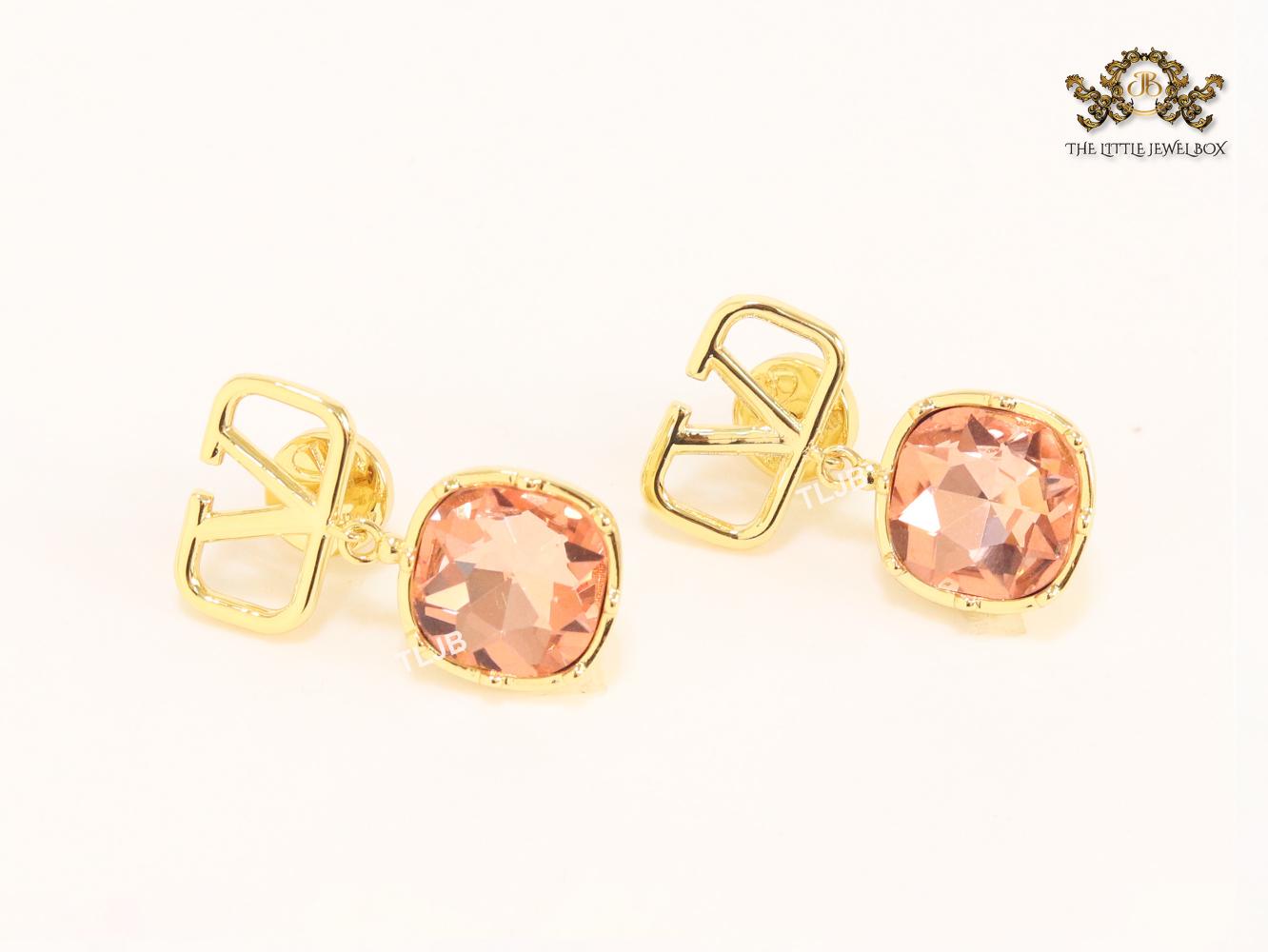 Alphabet open V dangles with pink stone