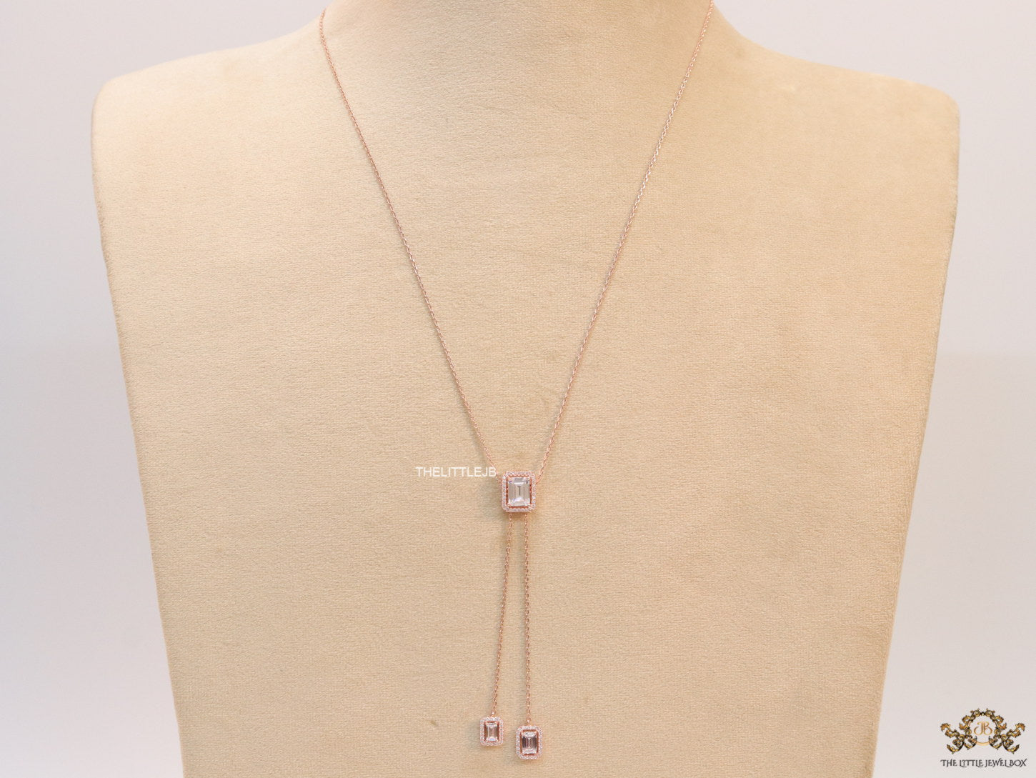 Emerald cut cubic zirconia stones in different sized on sleek rose gold plated chain