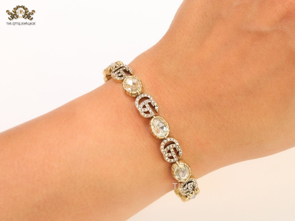 Double G cz with stone open gold bracelet