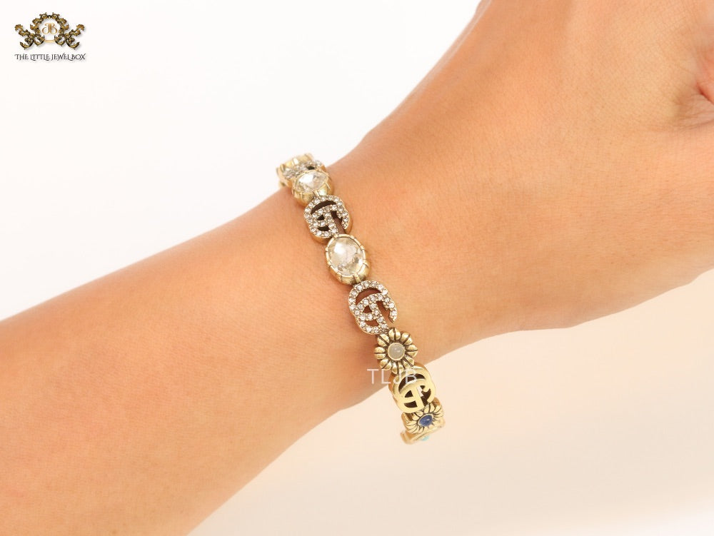 Double G cz with stone open gold bracelet