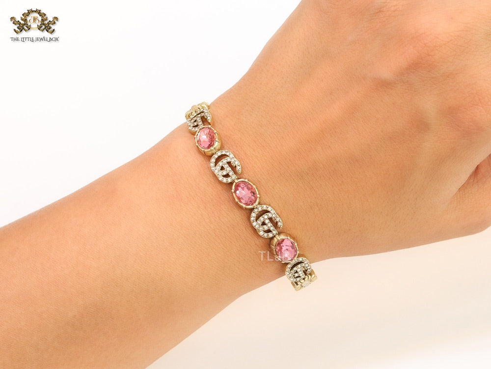 Double G cz with pink stone open gold bracelet