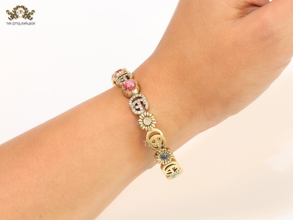 Double G cz with pink stone open gold bracelet
