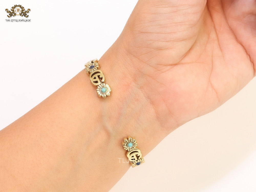 Double G cz with pink stone open gold bracelet