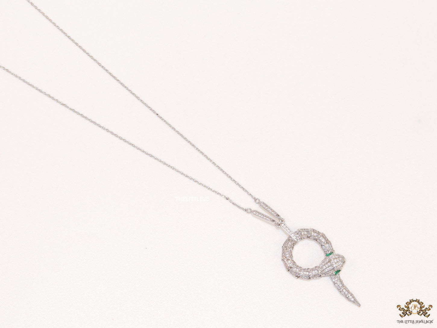 Sleek Platinum plated chain with Platinum plated cubic zirconia ancient snake symbol pendant