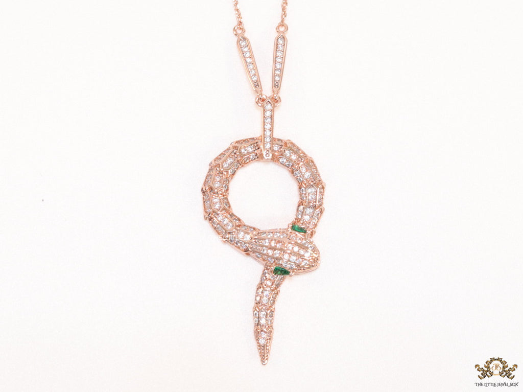 Sleek rose gold plated chain with gold plated cubic zirconia ancient serpentine symbol pendant