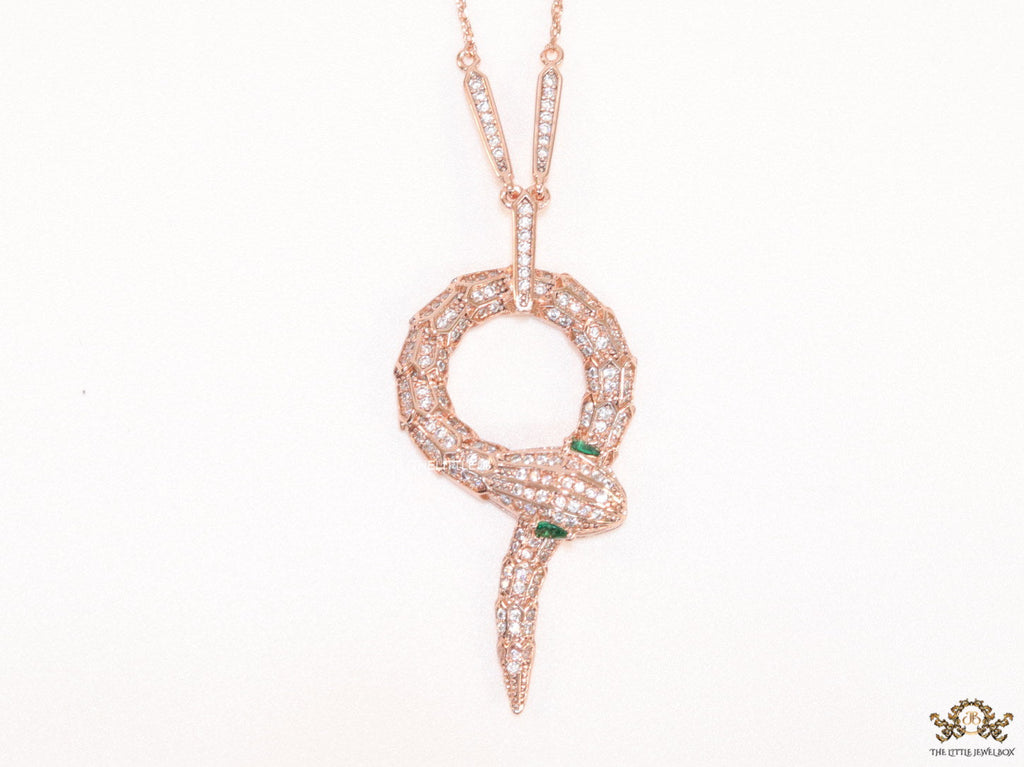 Sleek rose gold plated chain with gold plated cubic zirconia ancient snake symbol pendant