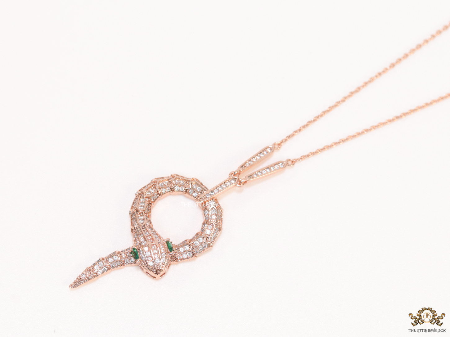 Sleek rose gold plated chain with gold plated cubic zirconia ancient serpentine symbol pendant