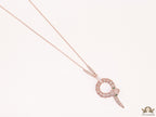 Sleek rose gold plated chain with gold plated cubic zirconia ancient serpentine symbol pendant