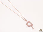 Sleek rose gold plated chain with gold plated cubic zirconia ancient snake symbol pendant