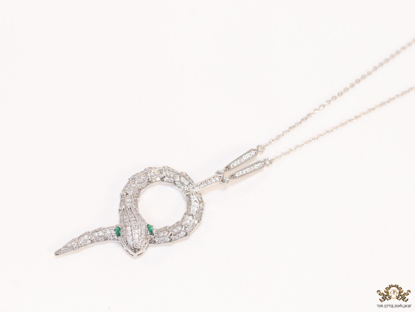 Sleek Platinum plated chain with Platinum plated cubic zirconia ancient serpentine symbol pendant