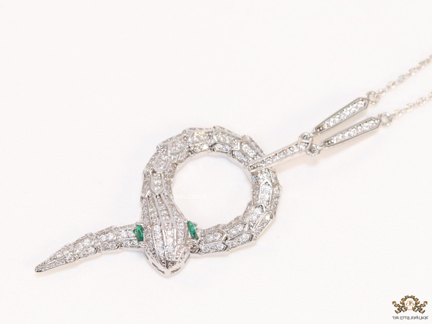 Sleek Platinum plated chain with Platinum plated cubic zirconia ancient serpentine symbol pendant