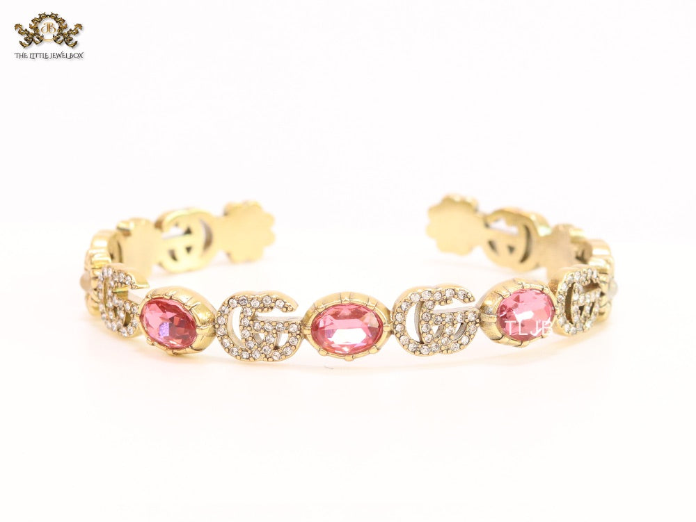 Double G cz with pink stone open gold bracelet