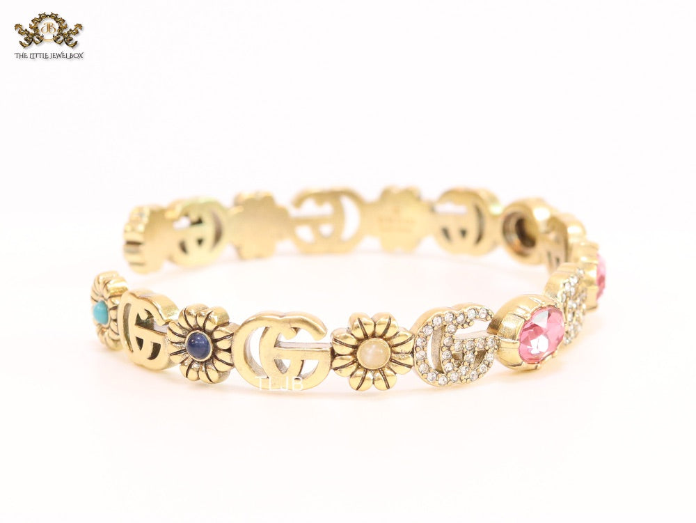 Double G cz with pink stone open gold bracelet