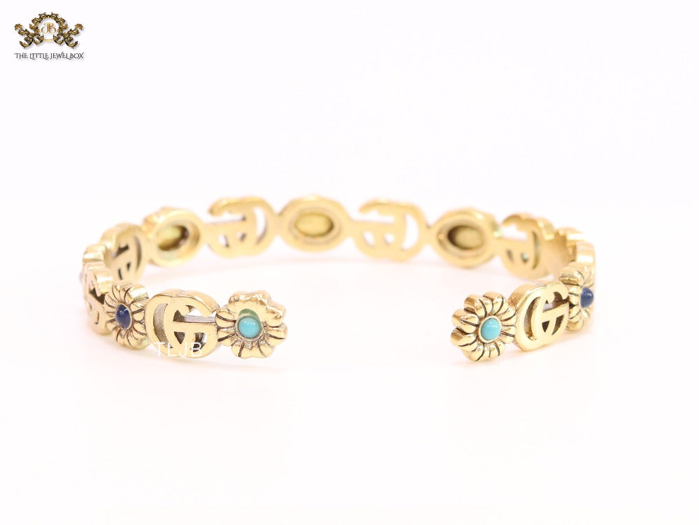 Double G cz with pink stone open gold bracelet
